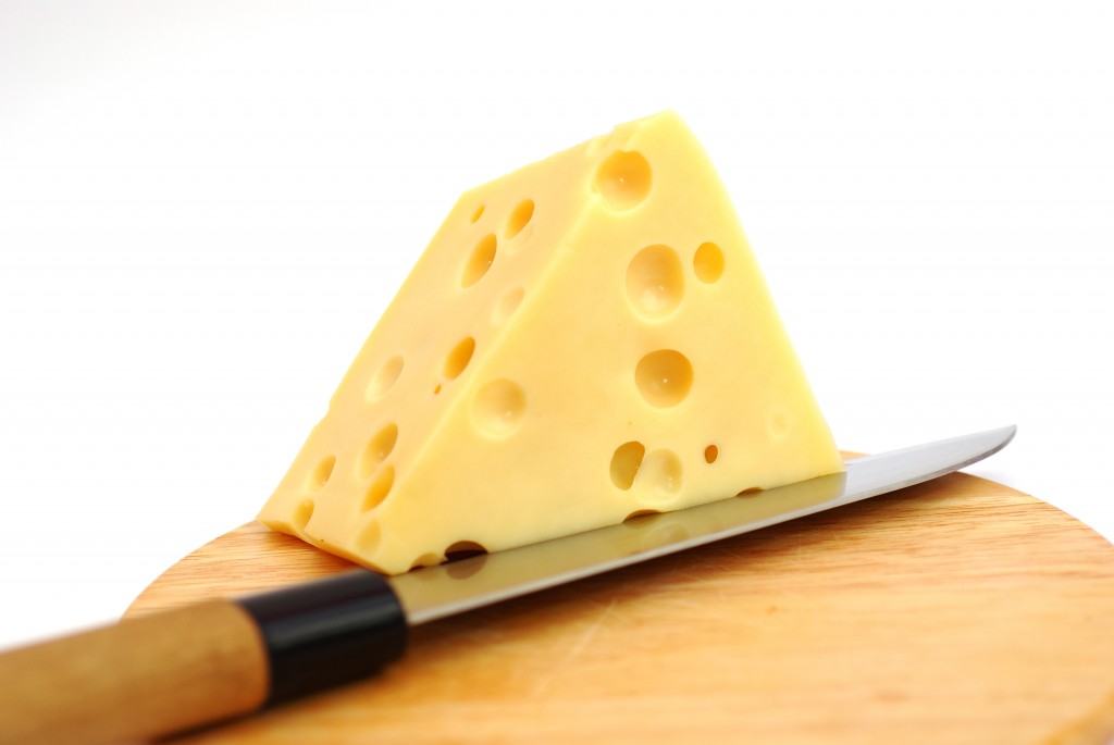 Piese of cheese on a white background